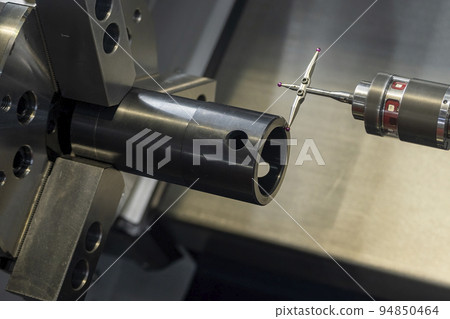 Close up scene the modular touch probe checking the tube parts on CNC lathe machine. Close up scene the modular touch probe checking the tube parts on CNC lathe machine. 94850464