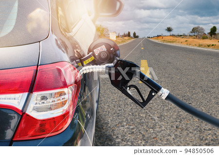 Fuel pump fill a tank of a car in a station 94850506
