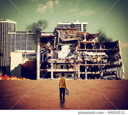 Child watches the destroyed city during the war 94850512