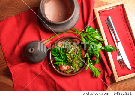Georgian green bean dish on a table of a restaurant. Dish of Georgian cuisine Georgian green bean dish on a table of a restaurant. Dish of Georgian cuisine 94852831