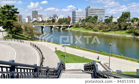The Okazaki cityscape seen from the pedestrian deck leading to Meitetsu Higashi-Okazaki Station [Otsugawa River Green Space/Okazaki City, Aichi Prefecture] 94853391