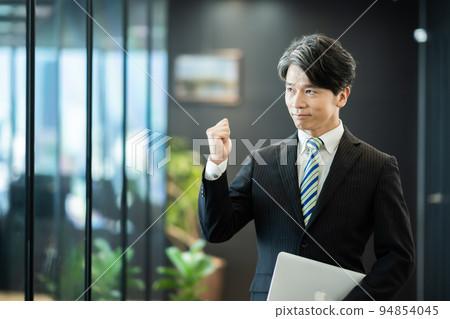 Guts pose middle male employee Guts pose middle male employee 94854045
