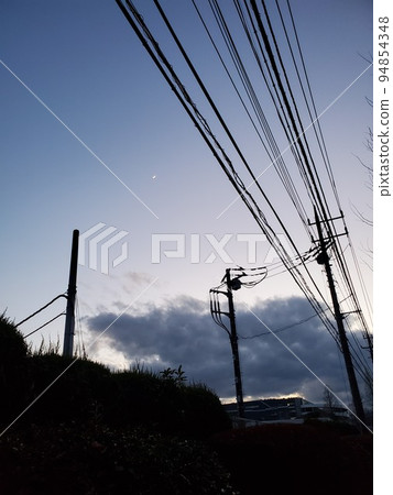 Telephone pole and sunset sky Telephone pole and sunset sky 94854348