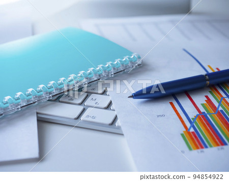 Business image of graphs, personal computers, notebooks Business image of graphs, personal computers, notebooks 94854922