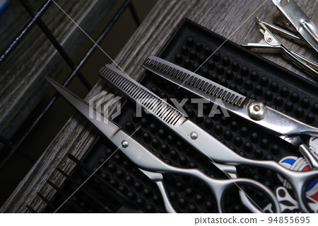 Vintage barber shop tools on old wooden background and rubber mat 94855695