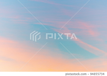 Cloudy pink and orange sky in late summer. 94855734