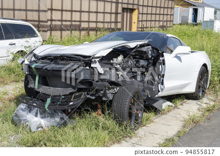 A car destroyed in a traffic accident. 94855817