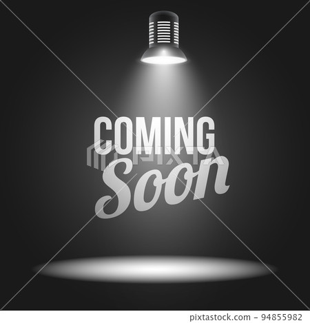 Coming soon message illuminated with light projector 94855982