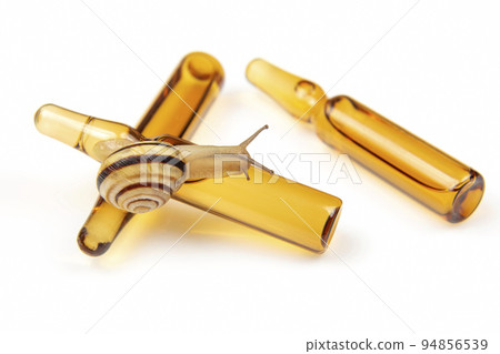 snail and medical ampoules for injections. mollusc and invertebrate snail and medical ampoules for injections. mollusc and invertebrate 94856539