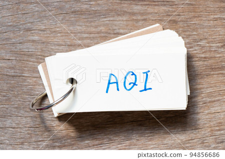 Flash card with handwriting in word AQI (Abbreviation of air quality index) on wood background Flash card with handwriting in word AQI (Abbreviation of air quality index) on wood background 94856686