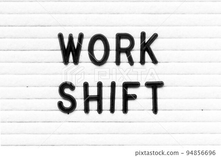 Black color letter in word work shift on white felt board background 94856696