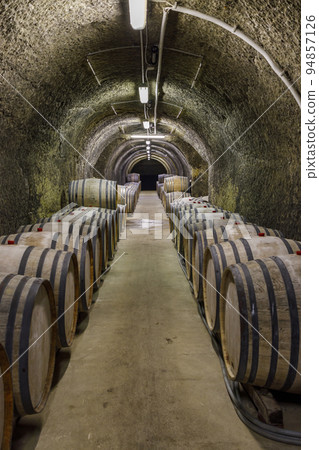 Wine cellars with barrels, traditional wine called Bikaver near Eger, Hungary Wine cellars with barrels, traditional wine called Bikaver near Eger, Hungary 94857126