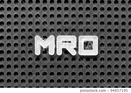 White alphabet letter in word MRO (Abbreviation of Maintenance, repair and overhaul or Maintenance, Repair and Operations) on black pegboard background 94857195