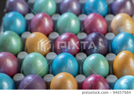 Easter background with hand painted purple, blue, green, orange Easter background with hand painted purple, blue, green, orange 94857984