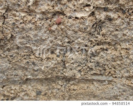 Background from rock texture close-up. The wall of natural stone of gray and brown. 94858514