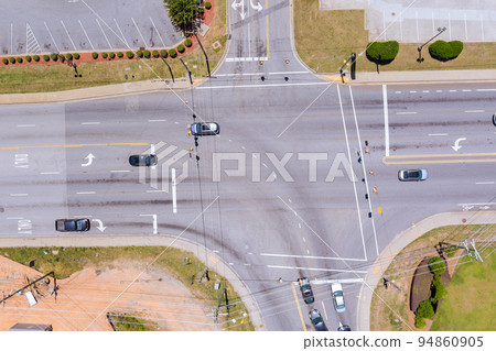 The intersection of roads where cars travel in both directions The intersection of roads where cars travel in both directions 94860905
