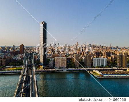 Skyline of New York Manhattan from an aerial view looking over the Manhattan Bridge to the Hudson River horizon 94860966