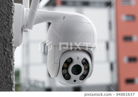 Security CCTV camera in office or shop building for protection against thieves, close up with copy space