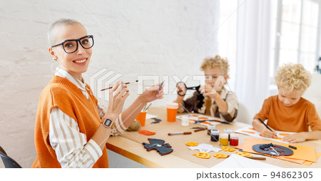 Young family mother and children preparing decorations for Halloween 94862305
