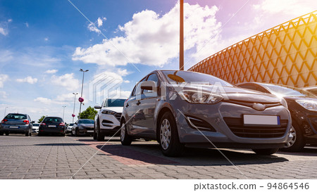 Parking lot cars. Car lot parking space in underground city garage. Empty road asphalt background. Industrial Shed or Parking Lot. 94864546