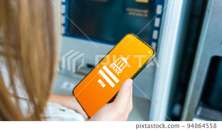 Online payment. Woman holding smartphone with internet online bank application. Debit card wallet app. Save currency money wallet. Online payment. Woman holding smartphone with internet online bank application. Debit card wallet app. Save currency money wallet. 94864558