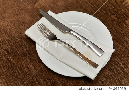 Cutlery on a teble 94864919