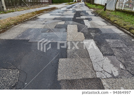 Patched broken road 94864997