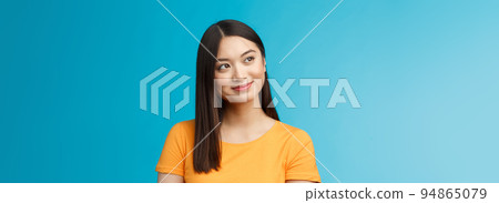 Close-up dreamy hopeful charming young asian woman wear yellow t-shirt turn sideways smiling delighted, contemplate beautiful summer scenery outside window sit office carefree, blue background Close-up dreamy hopeful charming young asian woman wear yellow t-shirt turn sideways smiling delighted, contemplate beautiful summer scenery outside window sit office carefree, blue background 94865079
