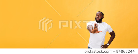 Portrait shock and annoyed displeased young man raising hands up to say no stop right there isolated orange background. Negative human emotion, facial expression, sign, symbol, body language 94865244