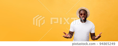 Young african american man wearing white t-shirt shouting and screaming loud to side with hand on mouth. Communication concept. 94865249
