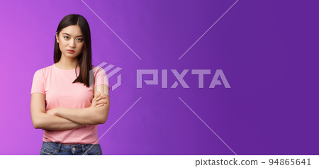 Bothered and pissed asian woman brunette, cross arms chest block, feeling offended annoyed, stare dismay disappointment, stand purple background upset irritated, fed up listen excuses 94865641
