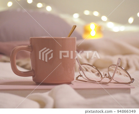 Relaxing tea time at night in the illuminated room 94866349