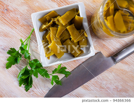 Green beans pickles on white plate 94866366
