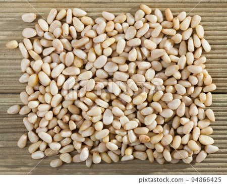 Picture of wooden desk with raw pine nut, nobody Picture of wooden desk with raw pine nut, nobody 94866425