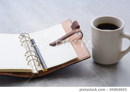Brown leather notebook and black coffee Brown leather notebook and black coffee 94868605