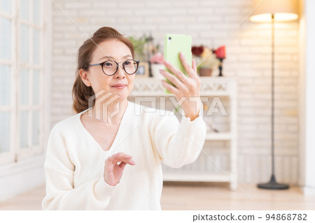 Senior woman looking at a smartphone Selfie Senior woman looking at a smartphone Selfie 94868782
