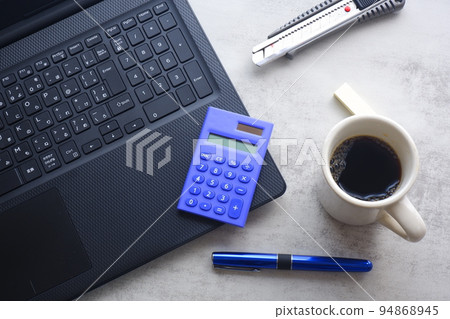 Working on a laptop (black) while drinking coffee Working on a laptop (black) while drinking coffee 94868945