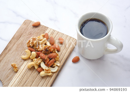 Nutritious and healthy mixed nuts and black coffee 94869193