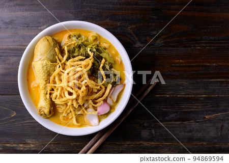 Northern Thai food (Khao Soi), Spicy curry noodles soup with chicken Northern Thai food (Khao Soi), Spicy curry noodles soup with chicken 94869594