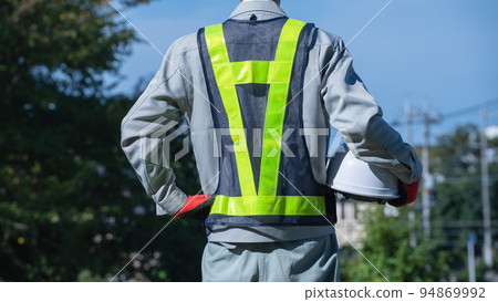Men in work clothes wearing safety vests | Construction industry, security guards, guard man image Men in work clothes wearing safety vests | Construction industry, security guards, guard man image 94869992