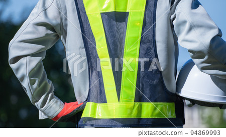 Men in work clothes wearing safety vests | Construction industry, security guards, guard man image Men in work clothes wearing safety vests | Construction industry, security guards, guard man image 94869993