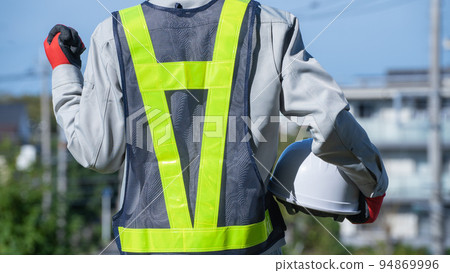 Men in work clothes wearing safety vests | Construction industry, security guards, guard man image 94869996