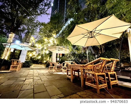 Stylish cobbled cafe terrace at night Stylish cobbled cafe terrace at night 94870683