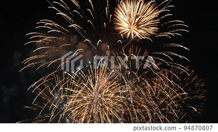 Golden Firework celebrate anniversary happy new year 2023, 4th of july holiday festival. Gold firework in the night time celebrate national holiday. Countdown to new year 2022 gold party time event 94870807