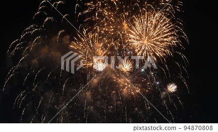 Golden Firework celebrate anniversary happy new year 2023, 4th of july holiday festival. Gold firework in the night time celebrate national holiday. Countdown to new year 2023 gold party time event Golden Firework celebrate anniversary happy new year 2023, 4th of july holiday festival. Gold firework in the night time celebrate national holiday. Countdown to new year 2023 gold party time event 94870808