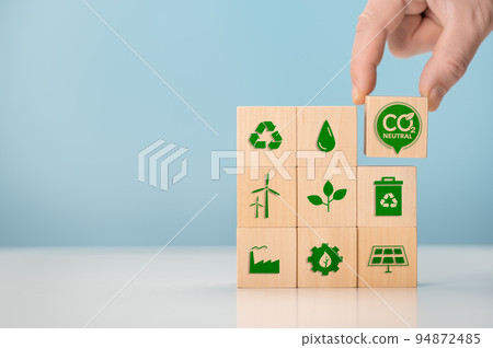Net zero and carbon neutral concept. Put wooden cubes with green net zero icon. CO2 Net-Zero Emission -Carbon Neutrality concept. renewable energy, co2 emissions reduction, green production Net zero and carbon neutral concept. Put wooden cubes with green net zero icon. CO2 Net-Zero Emission -Carbon Neutrality concept. renewable energy, co2 emissions reduction, green production 94872485