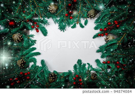 Christmas decoration with fir branches and spruce tufts on dark background with copy space. Merry Christmas and happy New year. Christmas decoration with fir branches and spruce tufts on dark background with copy space. Merry Christmas and happy New year. 94874084
