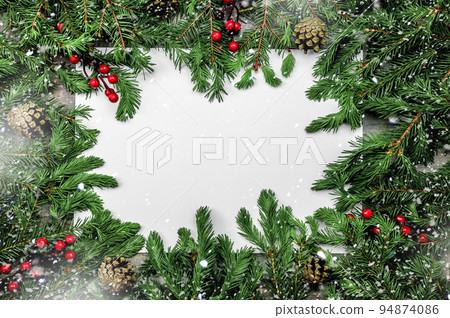 Christmas background with frosted fir tree. Snow Christmas composition with frame of fir branches and pine cones. Merry Christmas and happy New year. 94874086