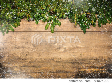 Christmas framework with snow and cones. Christmas wooden background with snow fir tree. Christmas rustic background with Christmas tree branches, cones, snow and red berries, winter festive Christmas framework with snow and cones. Christmas wooden background with snow fir tree. Christmas rustic background with Christmas tree branches, cones, snow and red berries, winter festive 94874090