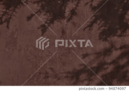 Shadow of leaves on brown concrete wall texture background Shadow of leaves on brown concrete wall texture background 94874097